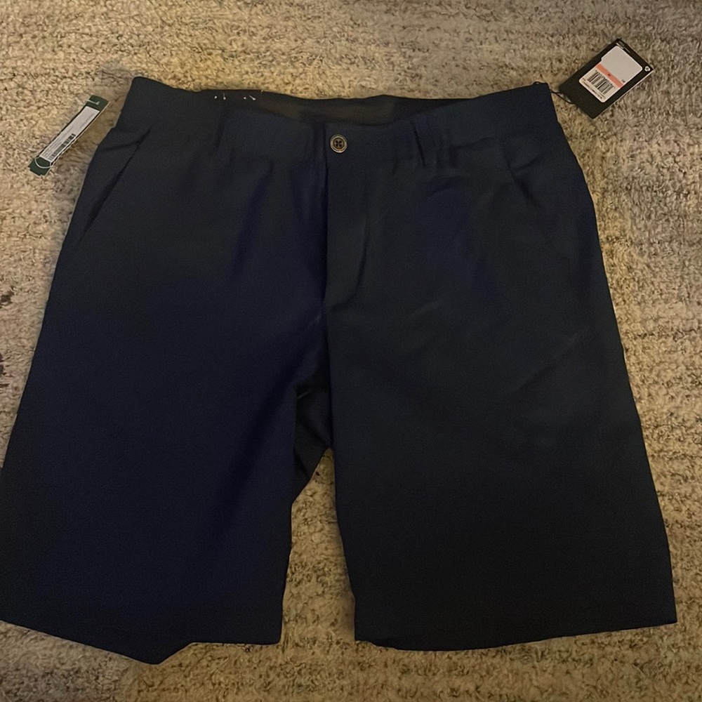 Under armour golf shorts! Never worn. Tags still on. Size 34, 10 in inseam